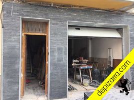 Fachada de pizarra en tiras.